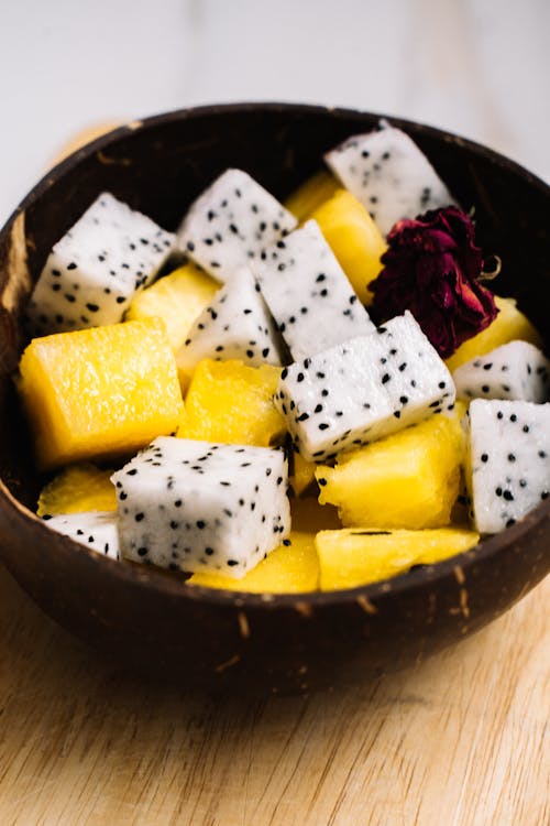 Free Fresh Fruit Slices on Wooden Bowl  Stock Photo